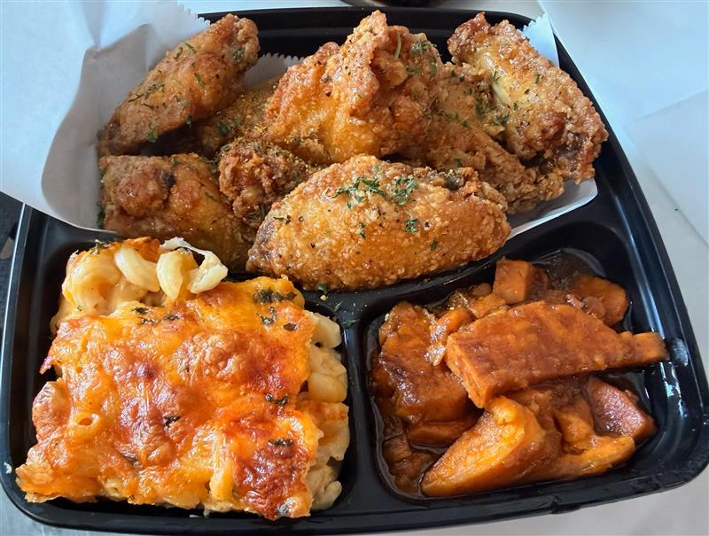 Wing platter box with mac & cheese and candied yams