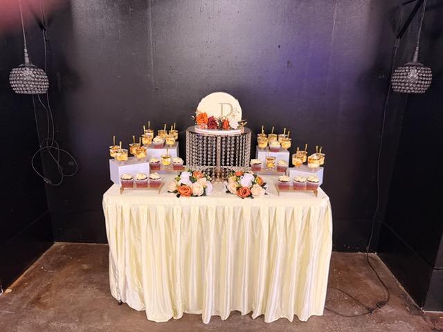 Elegant dessert table with cake and cups