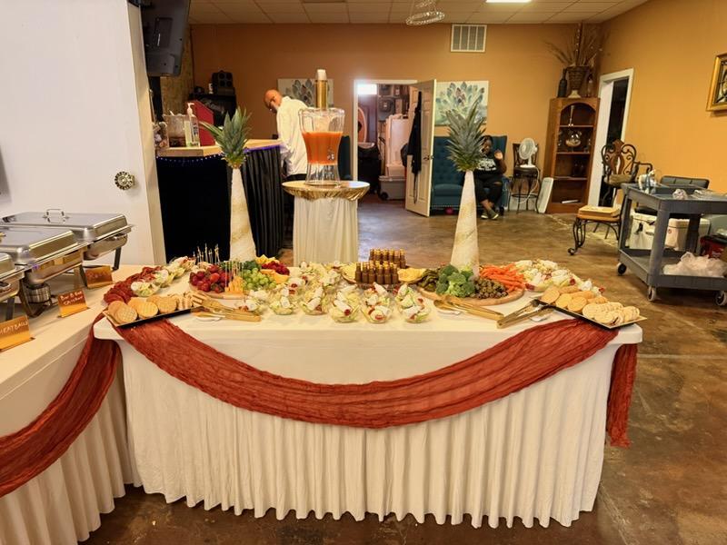 Appetizer and charcuterie spread with punch fountain