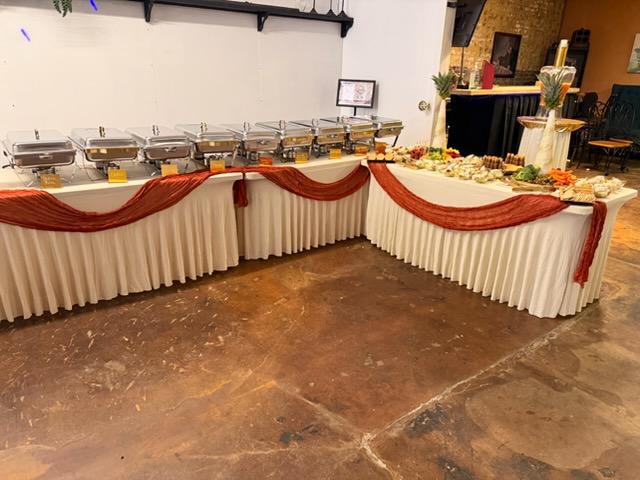 Draped buffet tables with chafing dishes